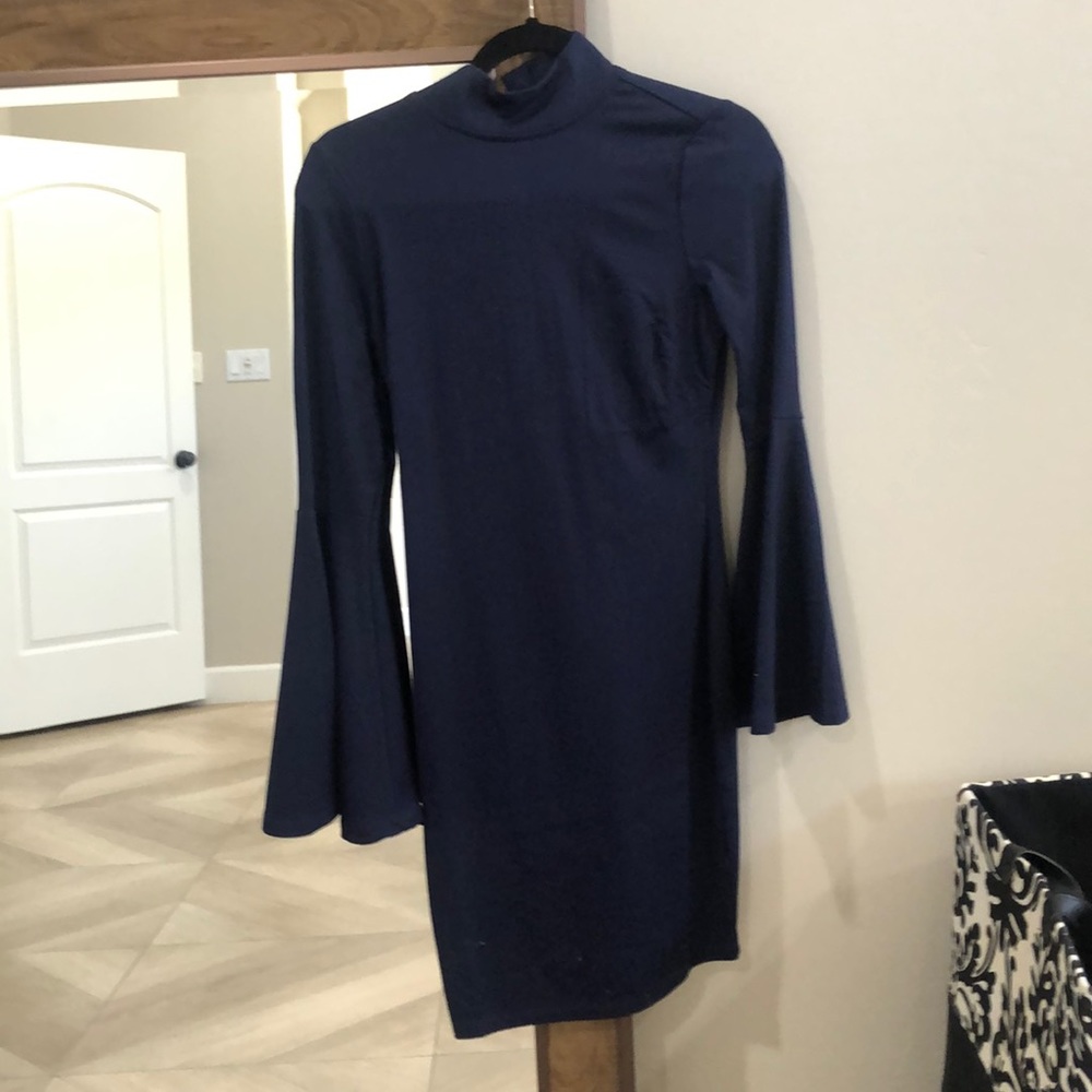 Form fitted high neck navy blue Venus dress.